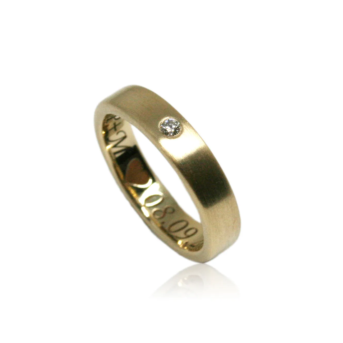 Minimal 14k yellow gold wedding ring with diamond